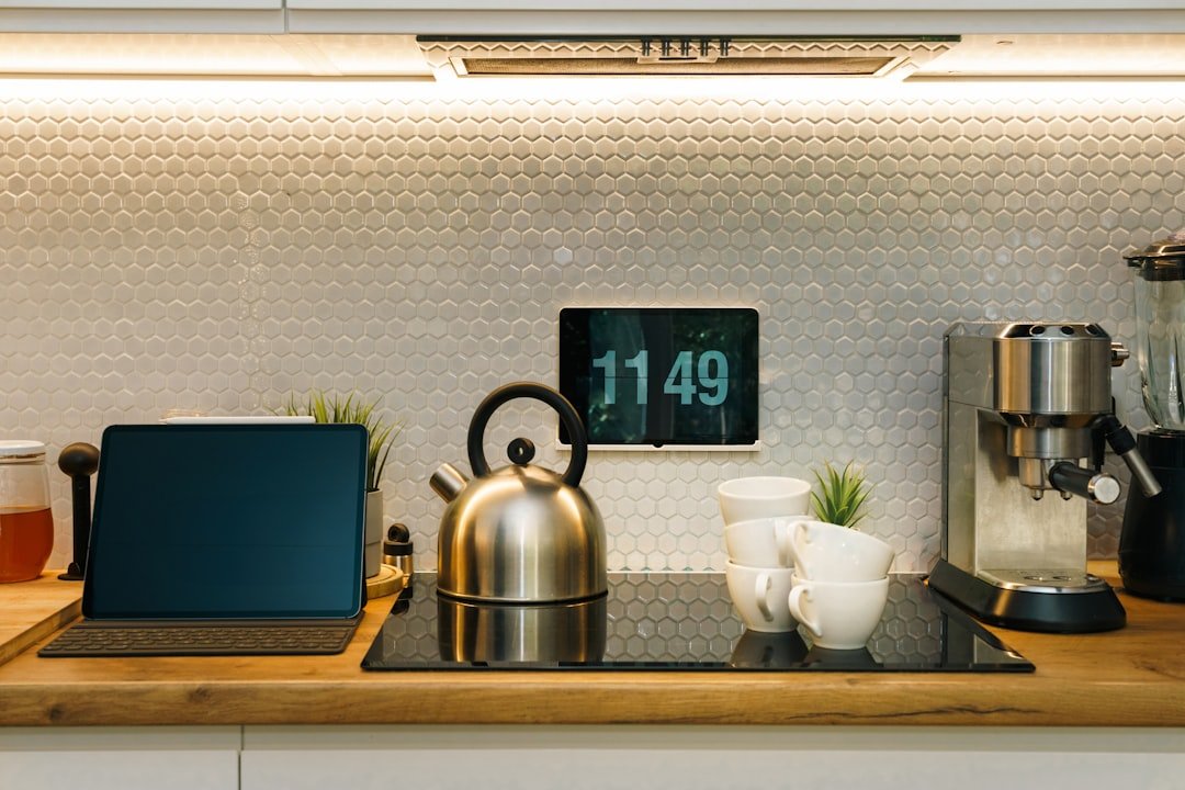 A modern kitchen with various electronic devices
