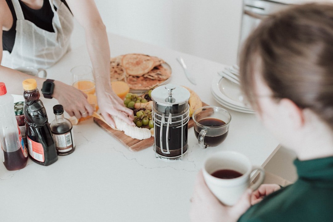 French press coffee and weekend breakfast pieces on a shared kitchen counter.
