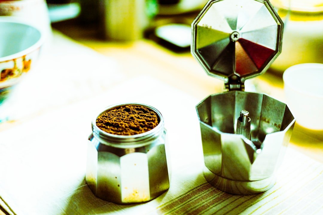 Portafilter and ground coffee ready for espresso prep.